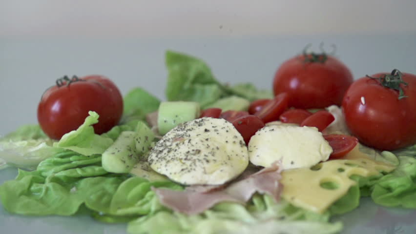 Sprinkle spices on tasty food, slow motion shot at 480fps
