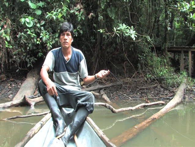 Indigenous Man fishing in the Amazon