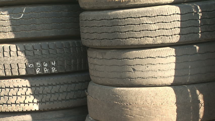 Used car tires stacked high, zoom in