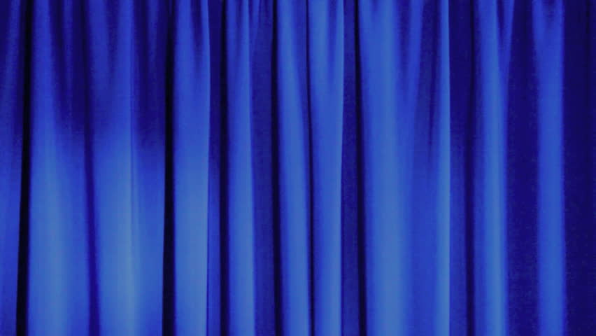 Old fashioned, elegant theater stage with velvet curtains with spotlight swirling around