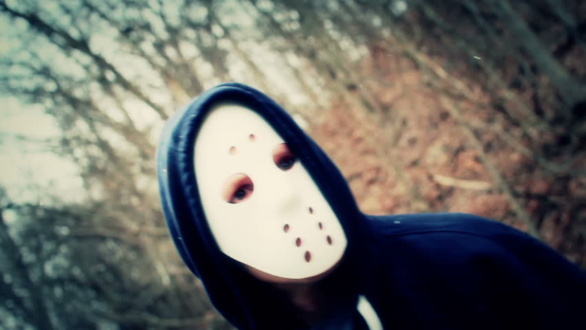 A masked killer stalks his victims on a wintery forest trail.
