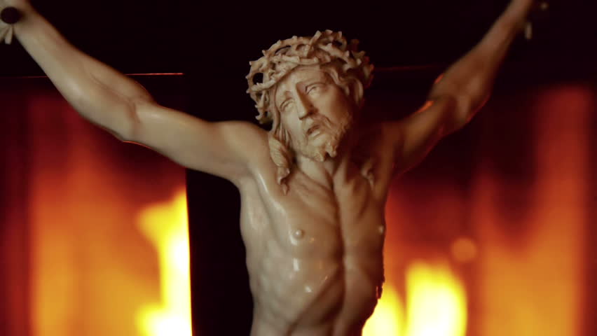 Christ in Cross With Flames Background Wider Shot.