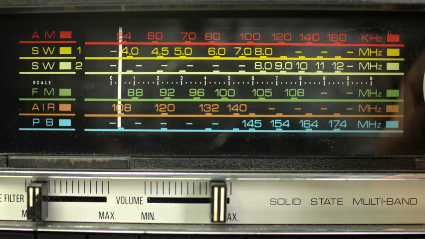 close up of an retro radio with the marker running through the different stations and frequencies