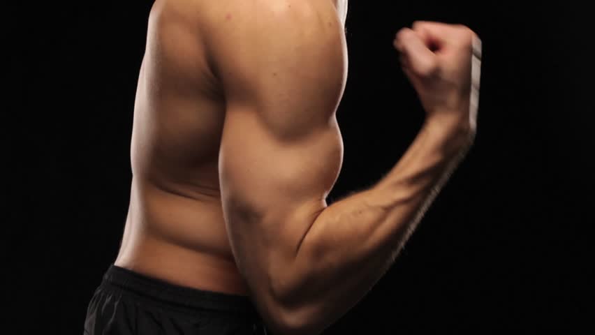 Side view of man doing arm lifts