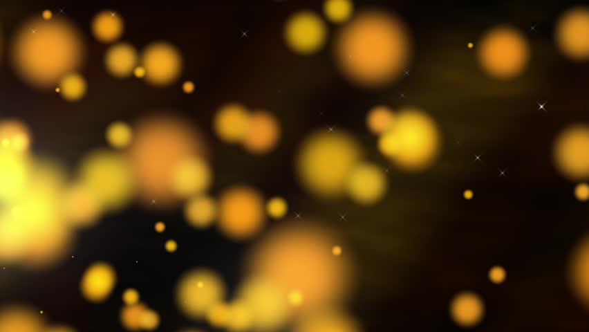 Perfectly seamless loop features glowing golden particles that float across the screen with a dark, text-friendly motion background behind.