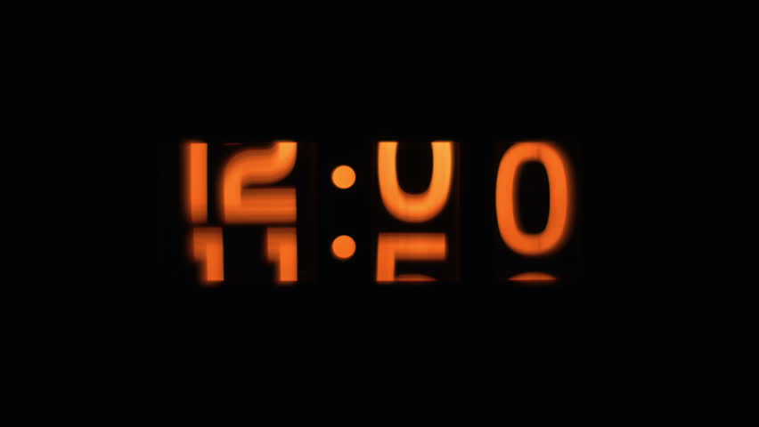 stop motion of an old style flip clock running through 12 hours