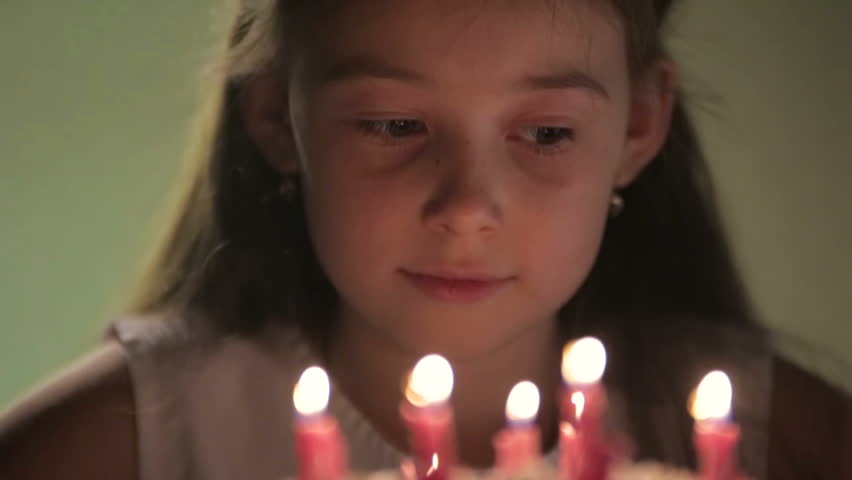 Birthday girl and cake with candles