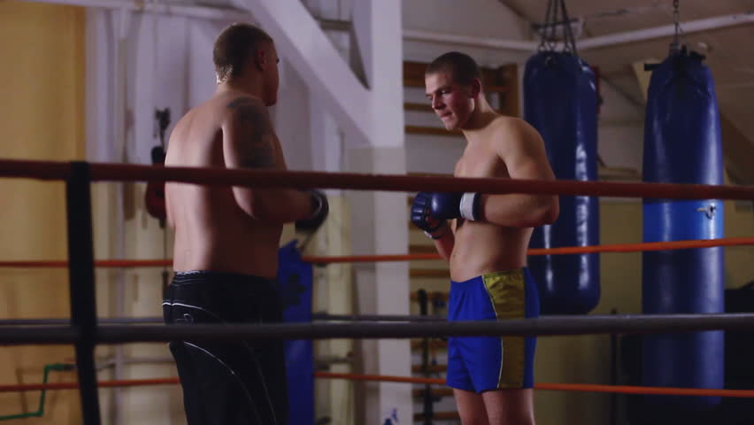 Two men sparring on ring