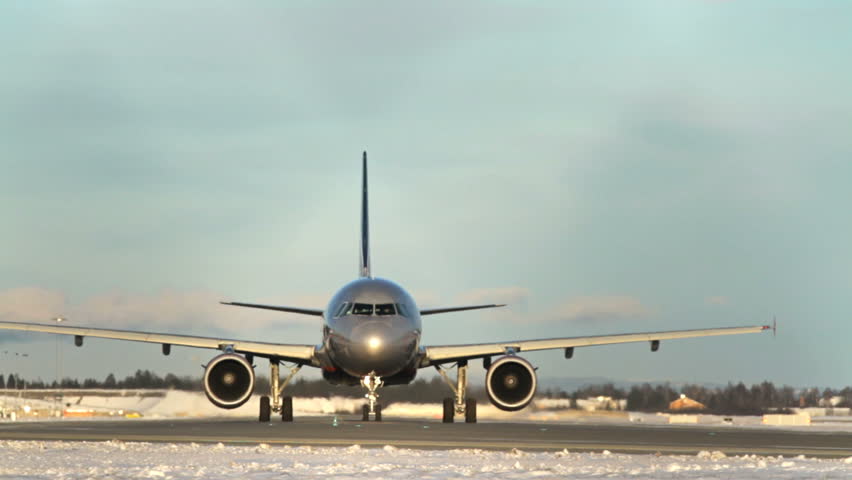 OSLO, NORWAY - DEC 6: Winter, cold weather at OSL Airport, Oslo Norway. Airplane taxing on December 6, 2012.