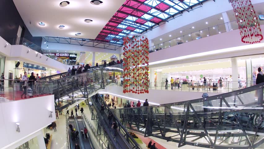 MOSCOW - OCT 28: (Time lapse) People in motion on escalators in Gagarinsky Mall, Oct 28, 2012 in Moscow, Russia. Gagarinsky shopping and entertaiment center is located on the third ring road in Moscow