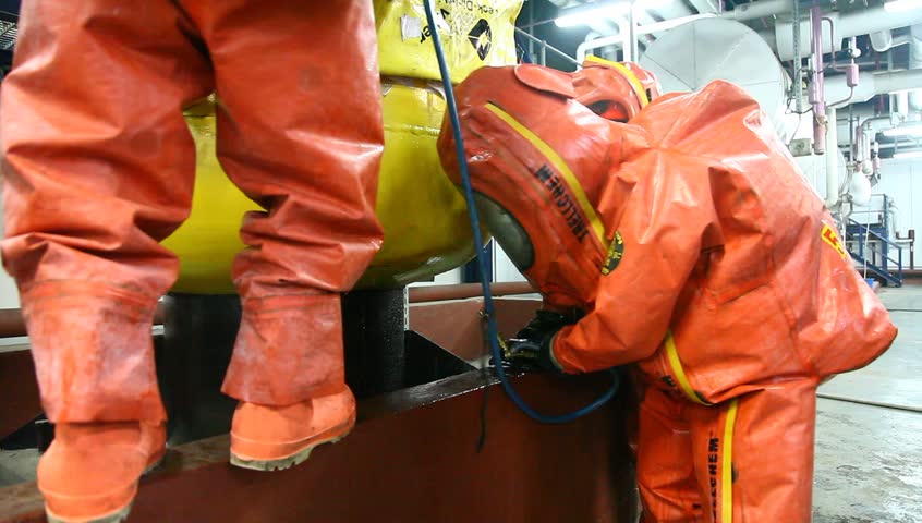NORTHERN ISRAEL -DECEMBER 17: Firefighters practice to remedy leak accident of corrosive toxic hazardous material Ammonia liquid in seven food factories using protective suites, Northern Israel December 17 2012