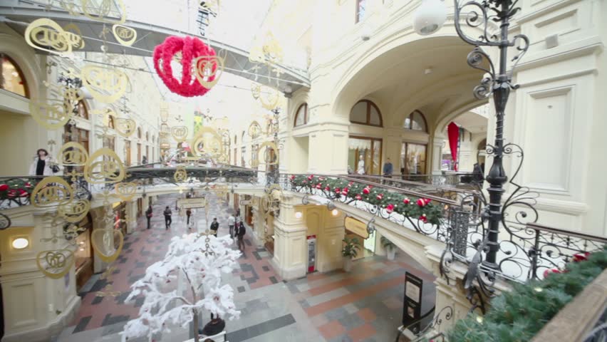 MOSCOW - JAN 20: People walk in GUM, view from second level on Jan 20, 2011 in Moscow, Russia. GUM belongs to Russian retailer Bosco di Ciliegi
