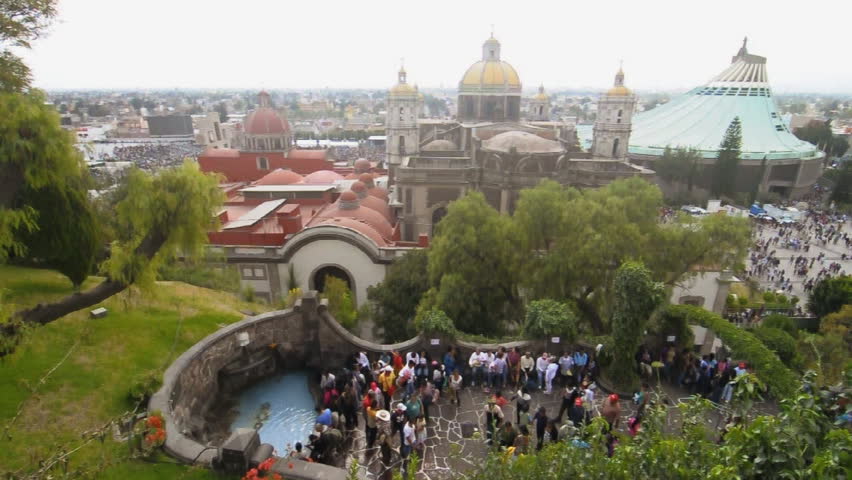 MEXICO CITY, MEXICO - DECEMBER 12, 2012: Thousands of faithful Catholics bless themselves with water from Tepeyac Hill during their to visit the Basilica of Our Lady of Guadalupe on December 12, 2012.