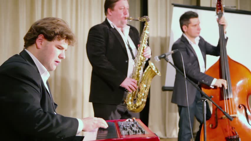 MOSCOW - DECEMBER 12: Trio band play music on stage during PolitProsvet award, December 12, 2011, Moscow, Russia. PolitProsvet is journalistic award, five finalists had been chosen from 25 contestants