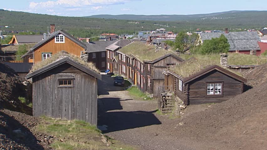 ROROS, RÃROS, NORWAY: slag heap pan sleggveien with wooden houses with dark pitch-log facades