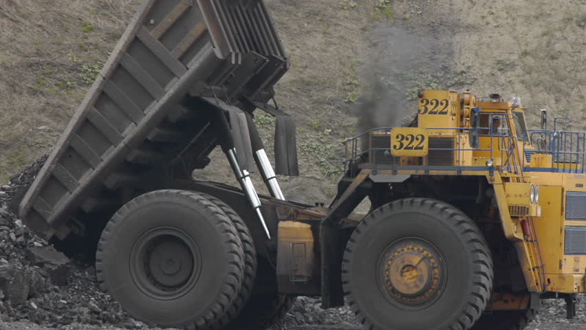 Mining dump trucks in the open pit mine, heavy truck in coal mine