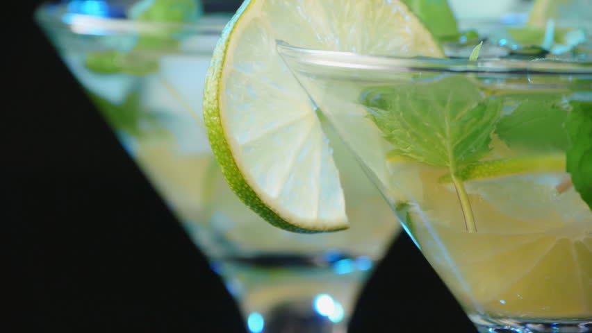 Martini cocktail with lime and mint closeup