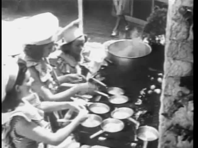 Women preparing food outdoors