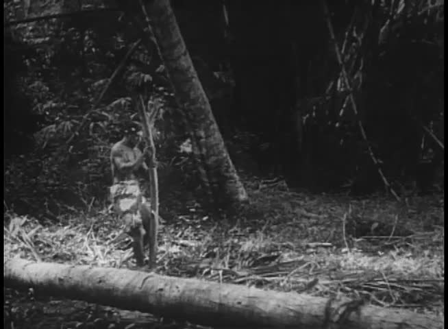 Natives preparing pyre to roast man