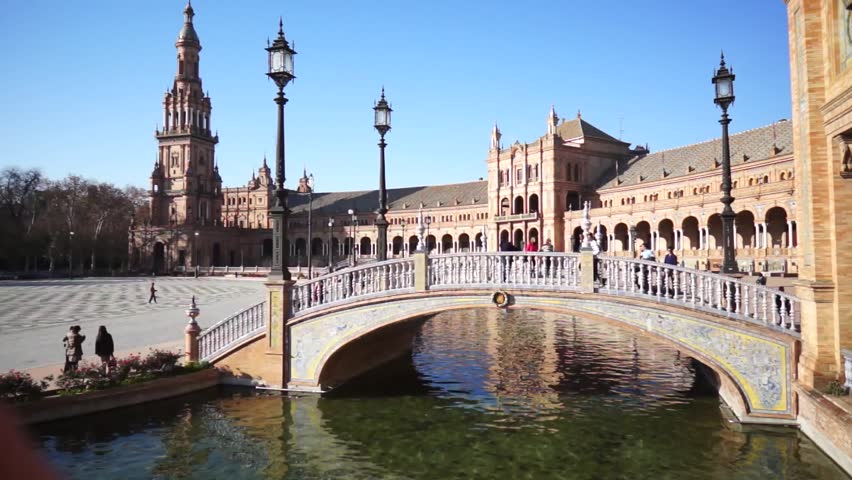 SEVILLE, SPAIN - JANUARY 6: Tourists enjoy a trip on boat on Plaza de Espana Seville on Jan 6, 2013 It was built in 1928 for the Ibero-American Exposition of 1929 designed by architect Anibal Gonzalez