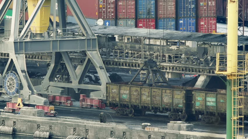 ODESSA - JANUARY 10 (TIMELAPSE): Port cranes unloads cars with coal on January 10, 2013 in Odessa, Ukraine. Odessa port is one of the largest trading ports located on the Black Sea coast.