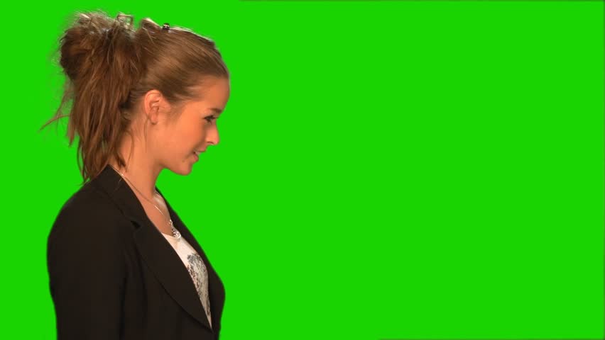 Girl blowing paper streamer. Green screen