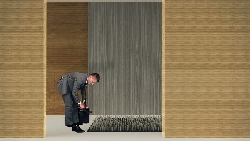 Businessman walking on nails, caution in business concept