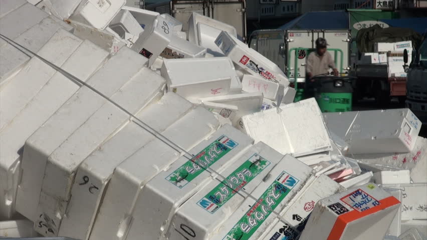 TOKYO, JAPAN - 7 NOVEMBER 2012: Foam boxes are being recycled, a fork lift is used to move the boxes towards the factory machine, at the Tsukiji fish market in Tokyo, Japan