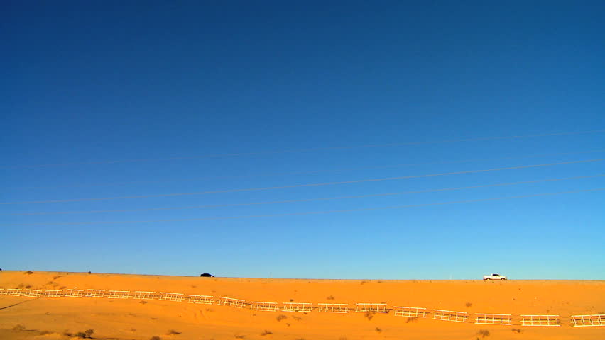 Trucks driving a desert highway