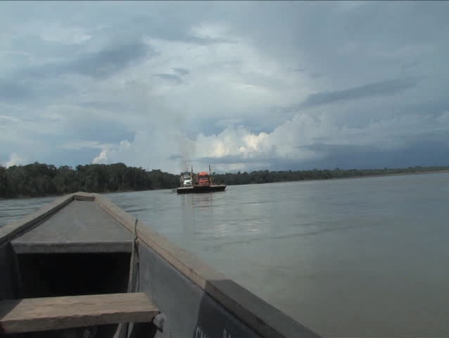 Passing a barge on the Napo River, Amazon