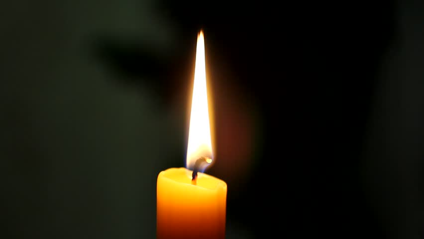 Candle flame varies under the influence of air currents.