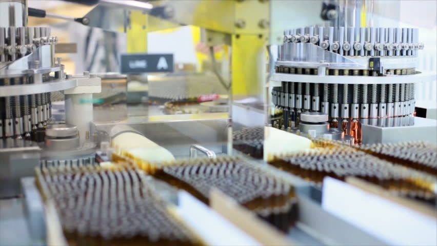 Automatic optical inspection machine, inspects vials and ampoules for particulates in liquid and container defects.
