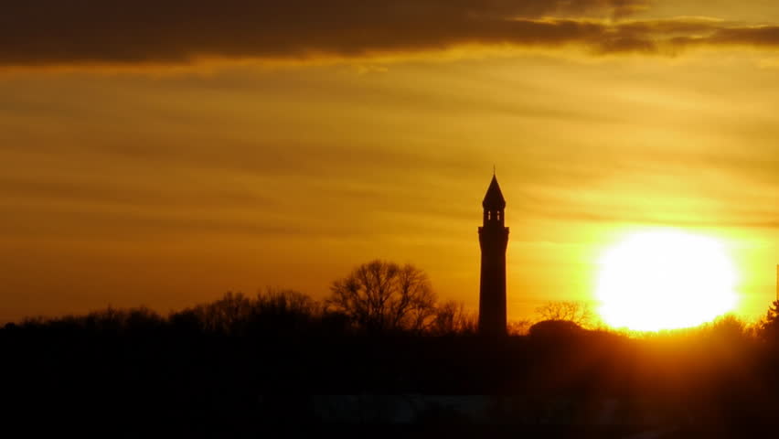 Birmingham University Clock Tower Sunset
Sun setting behind the clock tower at the Birmingham University 
campus at Selly Oak in Birmingham, England