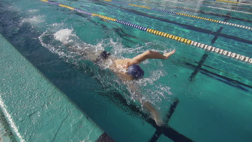 Slow Motion Of A Professional Male Swimmer Performing Front Crawl Stroke
