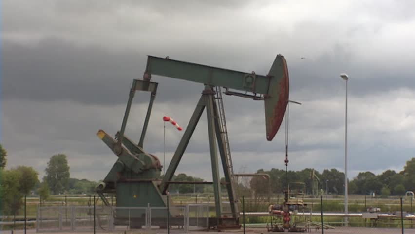 pump jack Emlichheim, Germany side view. The area is home of the largest onshore oil field in Europe; known as the Schoonebeek oilfield.
