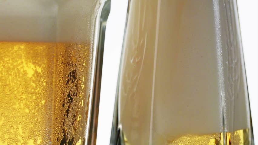 Lager beer pouring in glass, sliding video