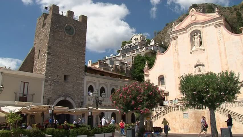 TAORMINA - SEPTEMBER, 8: people on Piazza IX Aprile near Chiesa di san Giuseppe September 08, 2011 in Taormina, Sicily, Italy. The church was built between late 1600 and early 1700 in Baroque style.