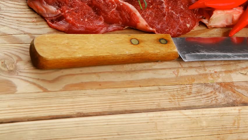 fresh spare ribs : raw lamb with thyme red chili pepper and green onion on wooden board