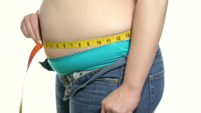 Overweight Female Measuring Waist  Color Measuring Tape.  Hands Sample Belly Fat.