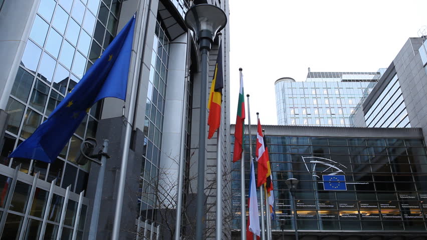 BRUSSELS, BELGIUM - DECEMBER 20: Flags in front of European Parliament Building in Brussels, Belgium on December 20, 2011.