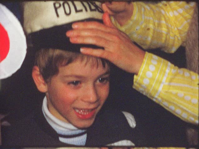 Vintage 8 mm film: Boy playing police man, 1970s