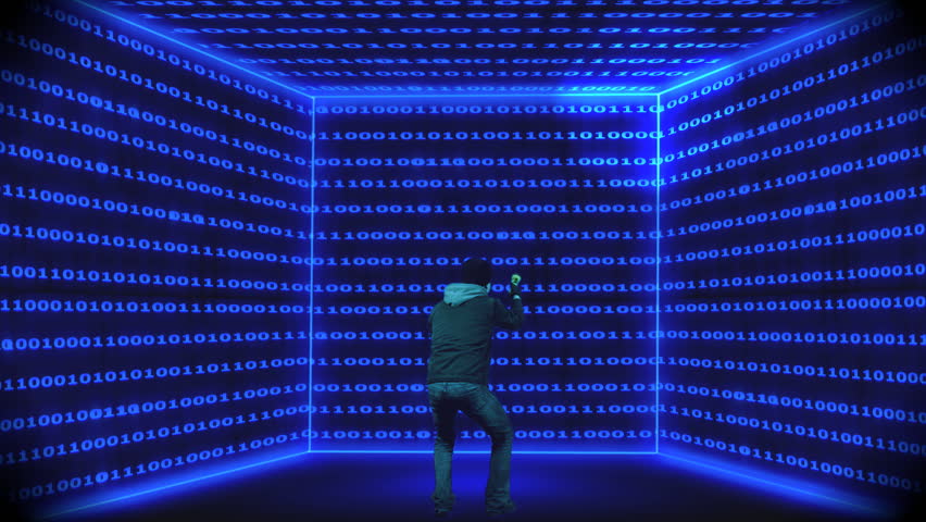 Man with a flahlight watching data streams on the surrounding walls
