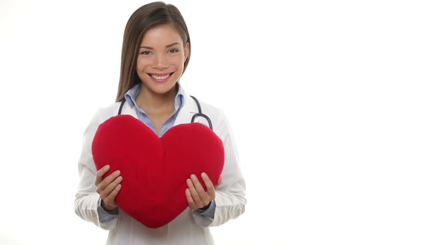 Medical doctor woman showing heart, giving heart, hugging heart and throwing heart on white background. Multicultural Asian Caucasian female medical professional smiling happy in health care concept.