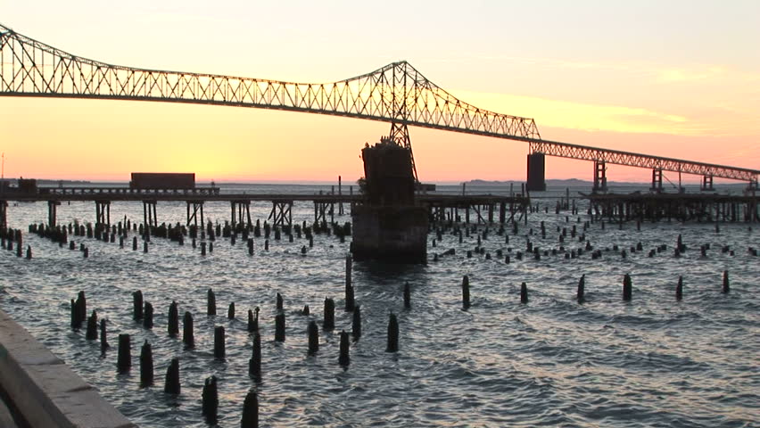 Astoria bridge at sundown with pilings, Oregon