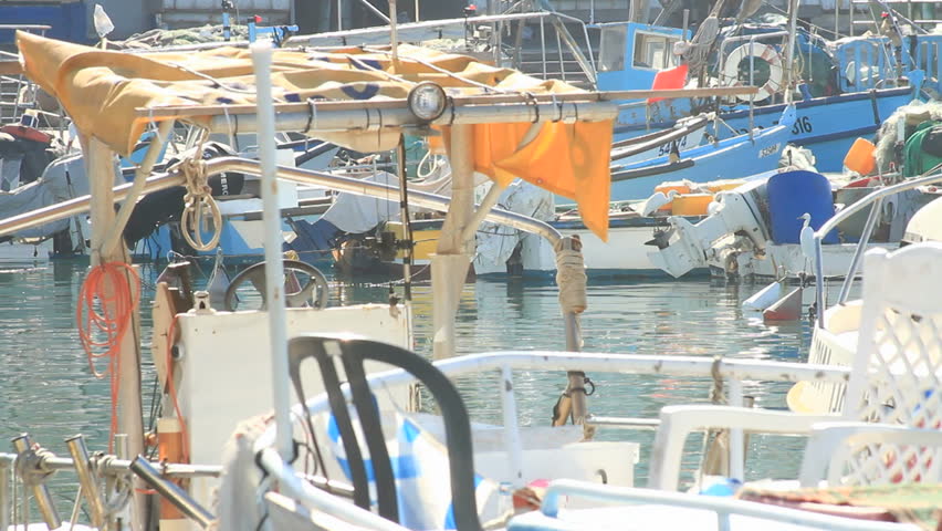 boats anchored on the water at Jaffa port on still water