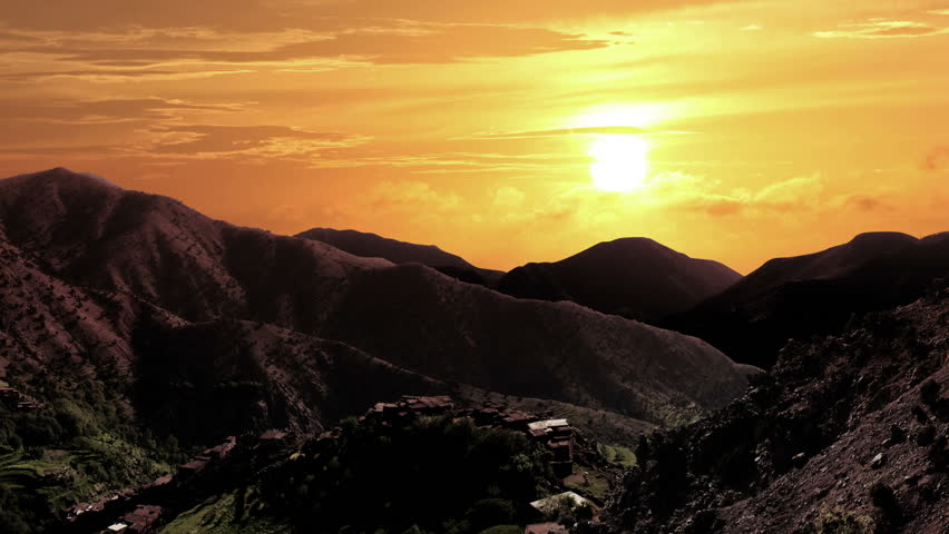 Panoramic of High Atlas mountains in Morocco with timelapse cloudscape