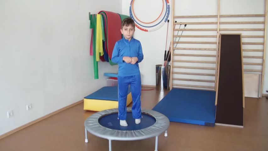 Child does therapeutic exercises in the gym