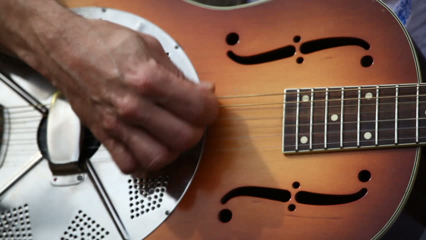 guitar player performing on street