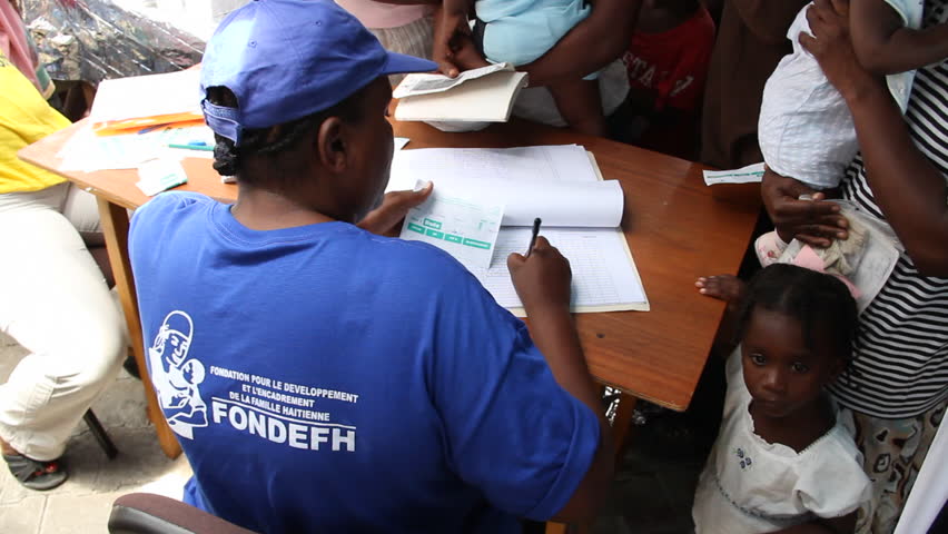 HAITI - CIRCA MAY 2012: record-keeping at vaccination clinic in  Port-Au-Prince 
