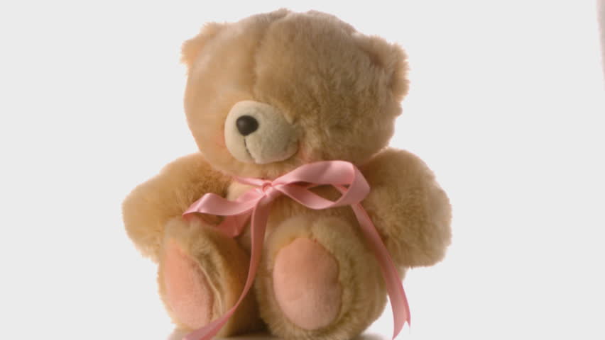 Cute teddy bear falling and bouncing in slow motion